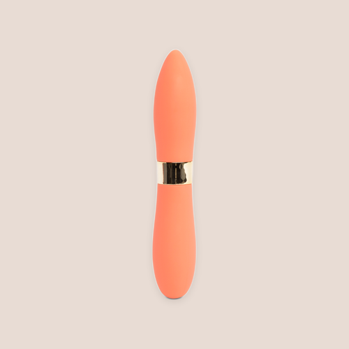 Beguiled — intimate massager on a warm blush background
