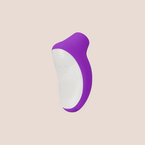 Beholden — intimate massager on a warm blush background