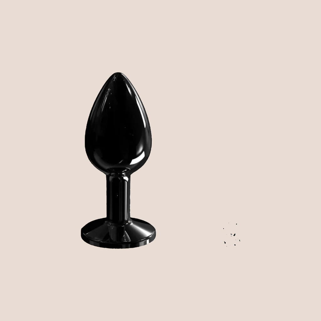 Bejewelled — weighted intimate plug on a warm blush background