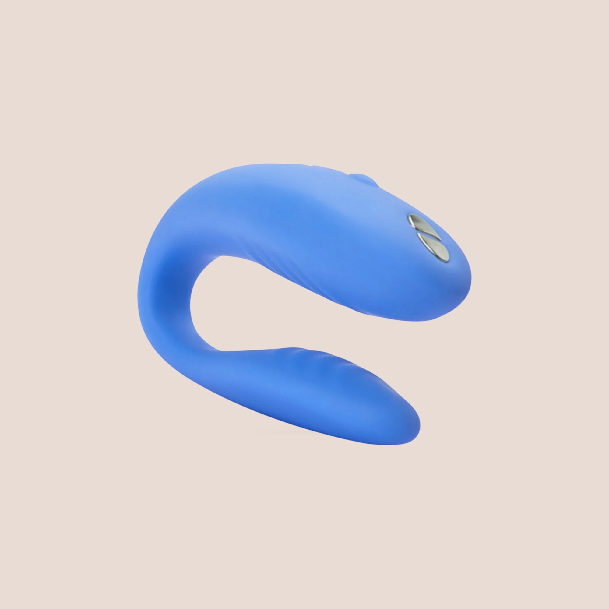 Complemented — intimate massager on a warm blush background