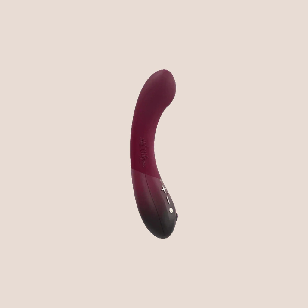Contoured — intimate massager on a warm blush background