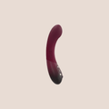 Contoured — intimate massager on a warm blush background