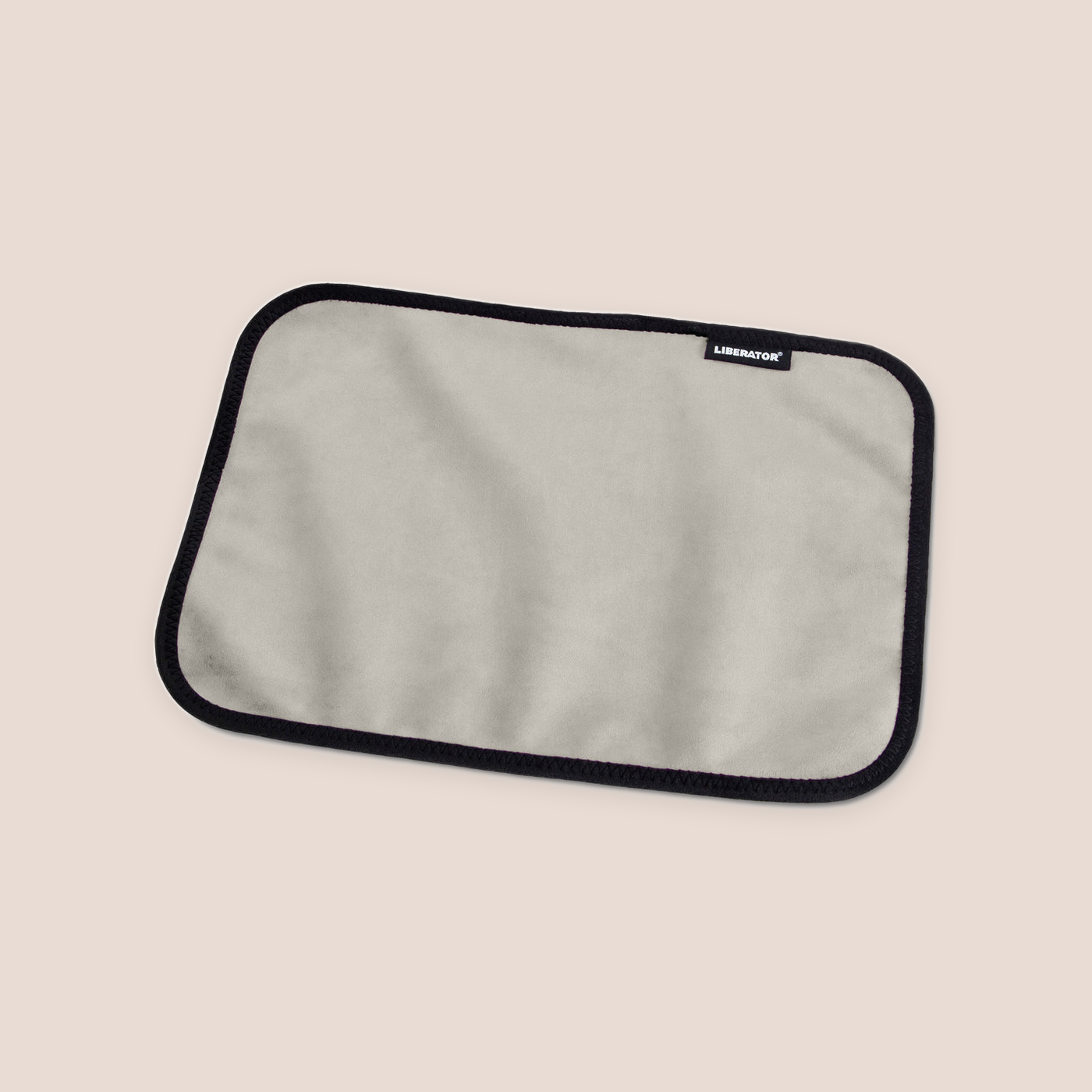 Covered — intimacy support furniture on a warm blush background
