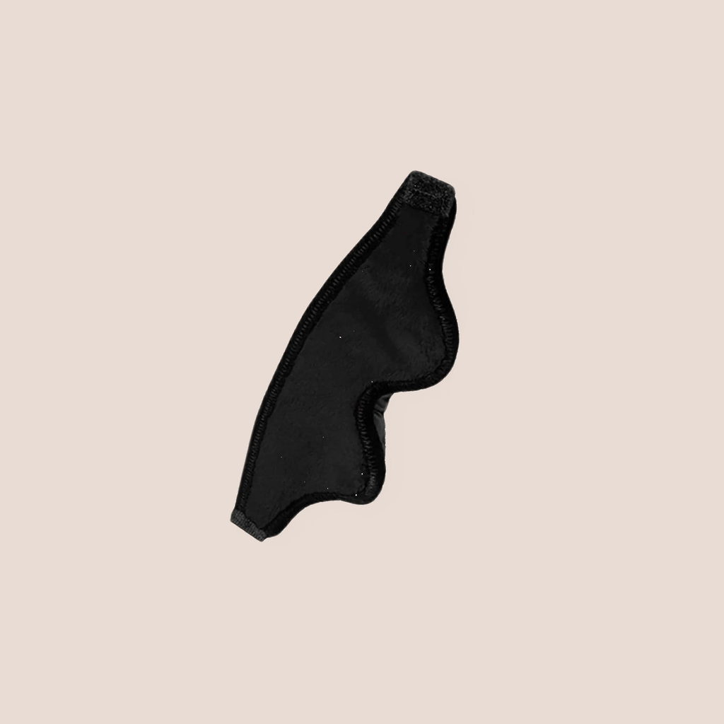 Darkened — restraint piece on a warm blush background