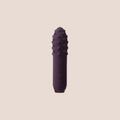 Scintillating — intimate massager on a warm blush background