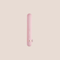 Forged — intimate massager on a warm blush background