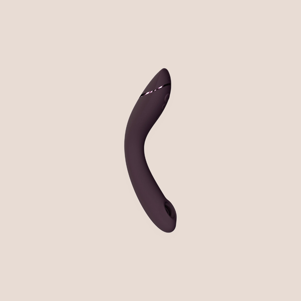 Genuine — intimate massager on a warm blush background