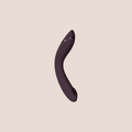 Genuine — intimate massager on a warm blush background