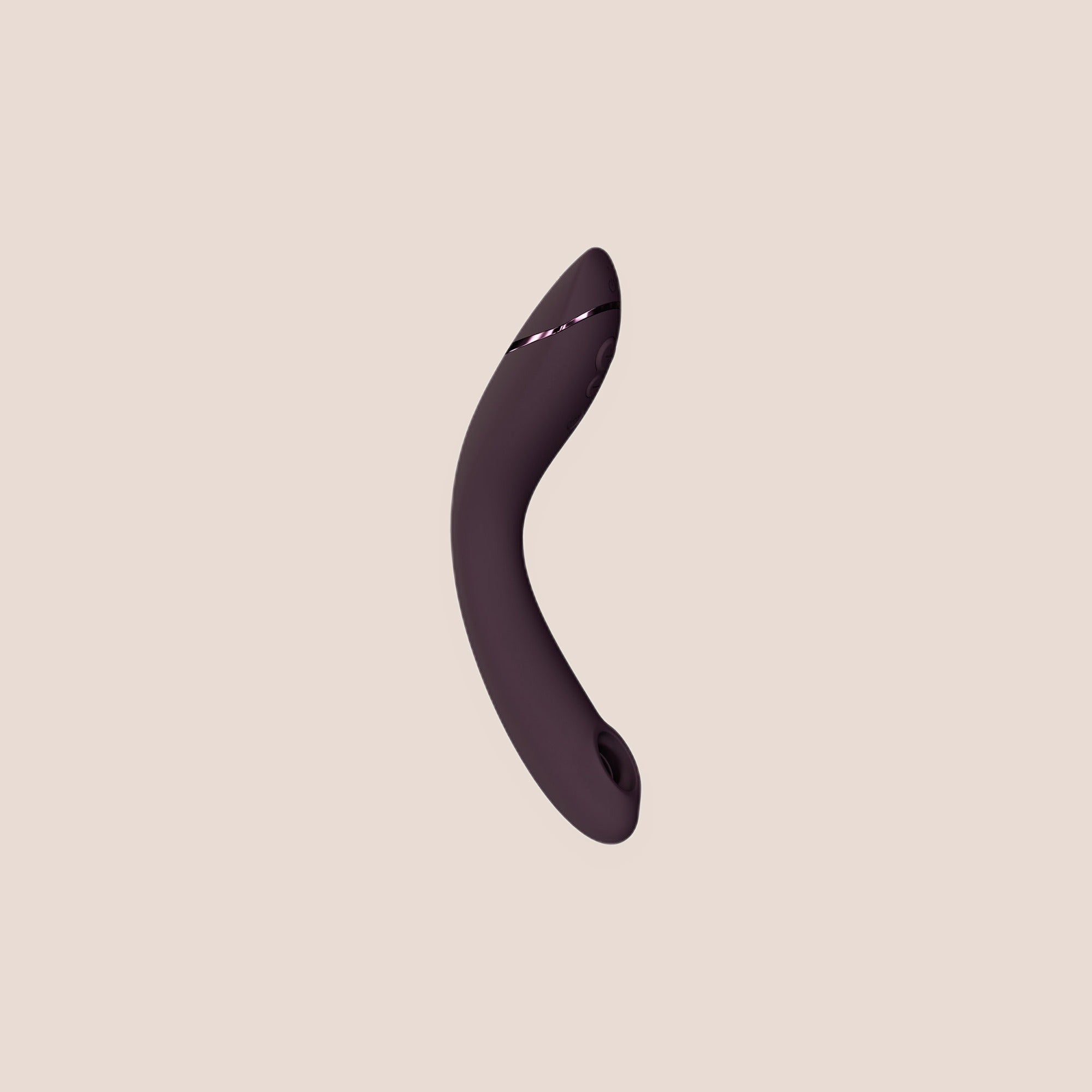 Genuine — intimate massager on a warm blush background