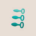 Gradual — weighted intimate plug on a warm blush background