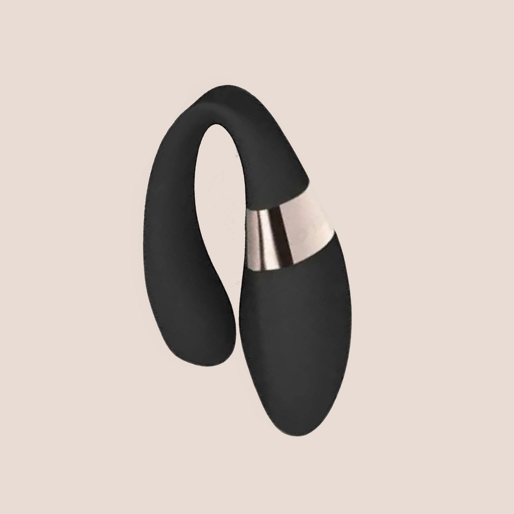 Harmonious — intimate massager on a warm blush background