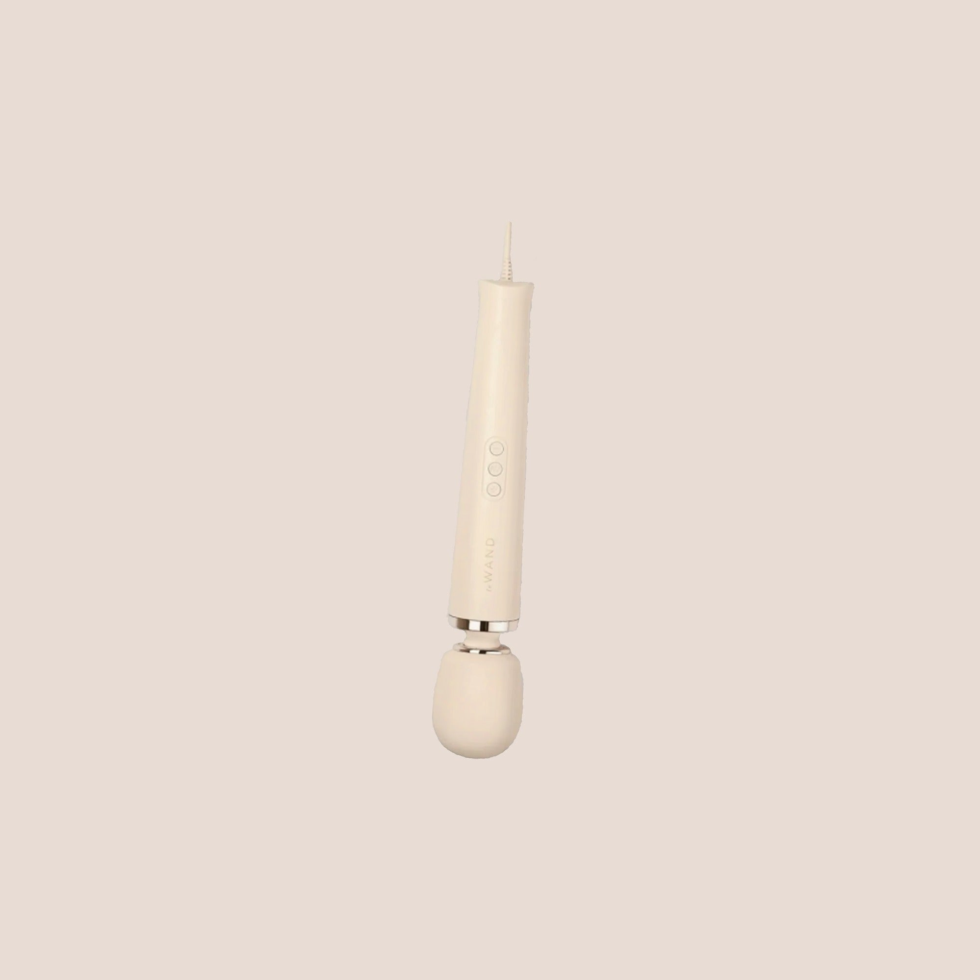 Kindled — intimate massager on a warm blush background