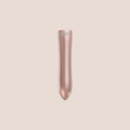 Whetted — intimate massager on a warm blush background