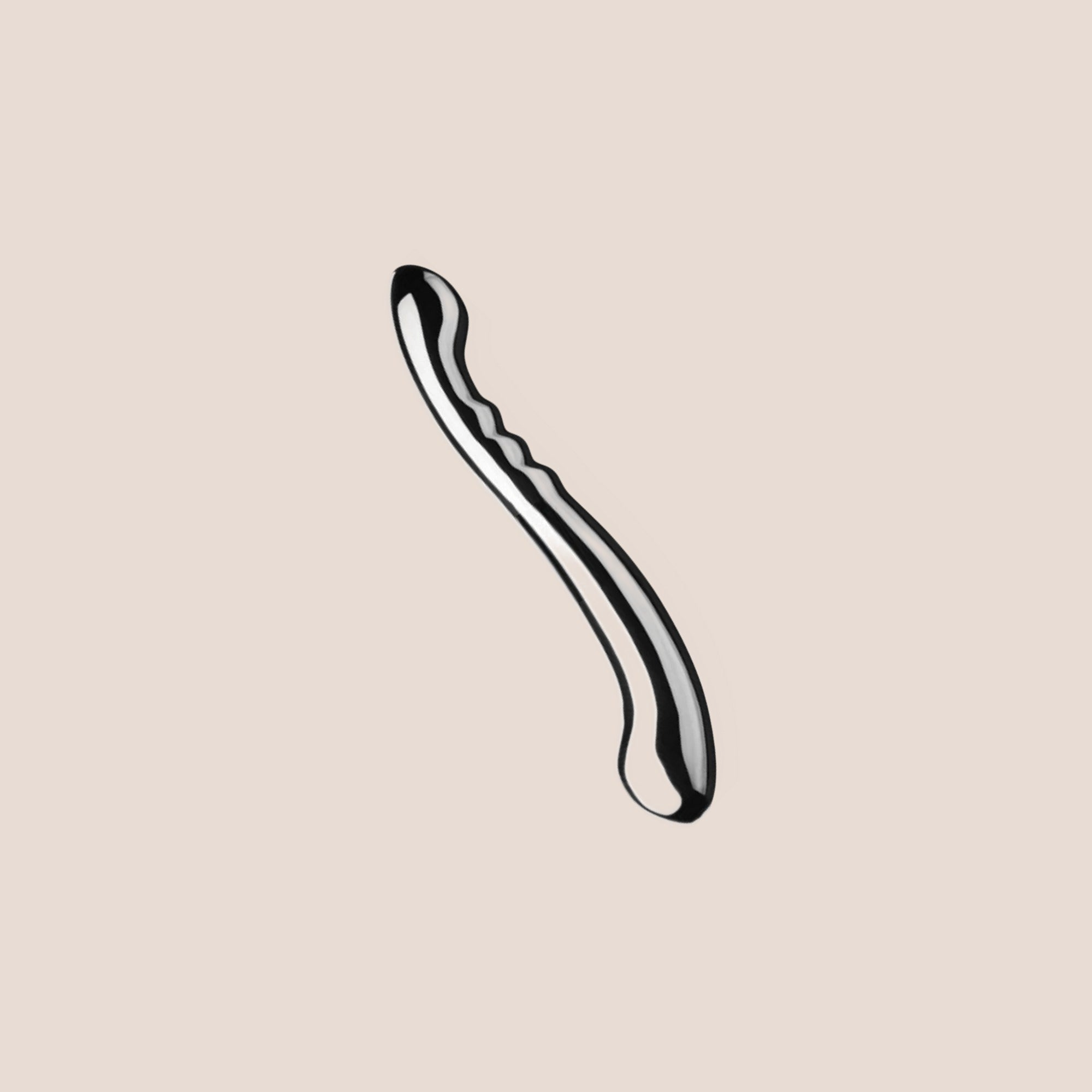Moulded — weighted intimate plug on a warm blush background