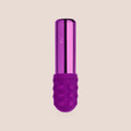 Moved — intimate massager on a warm blush background