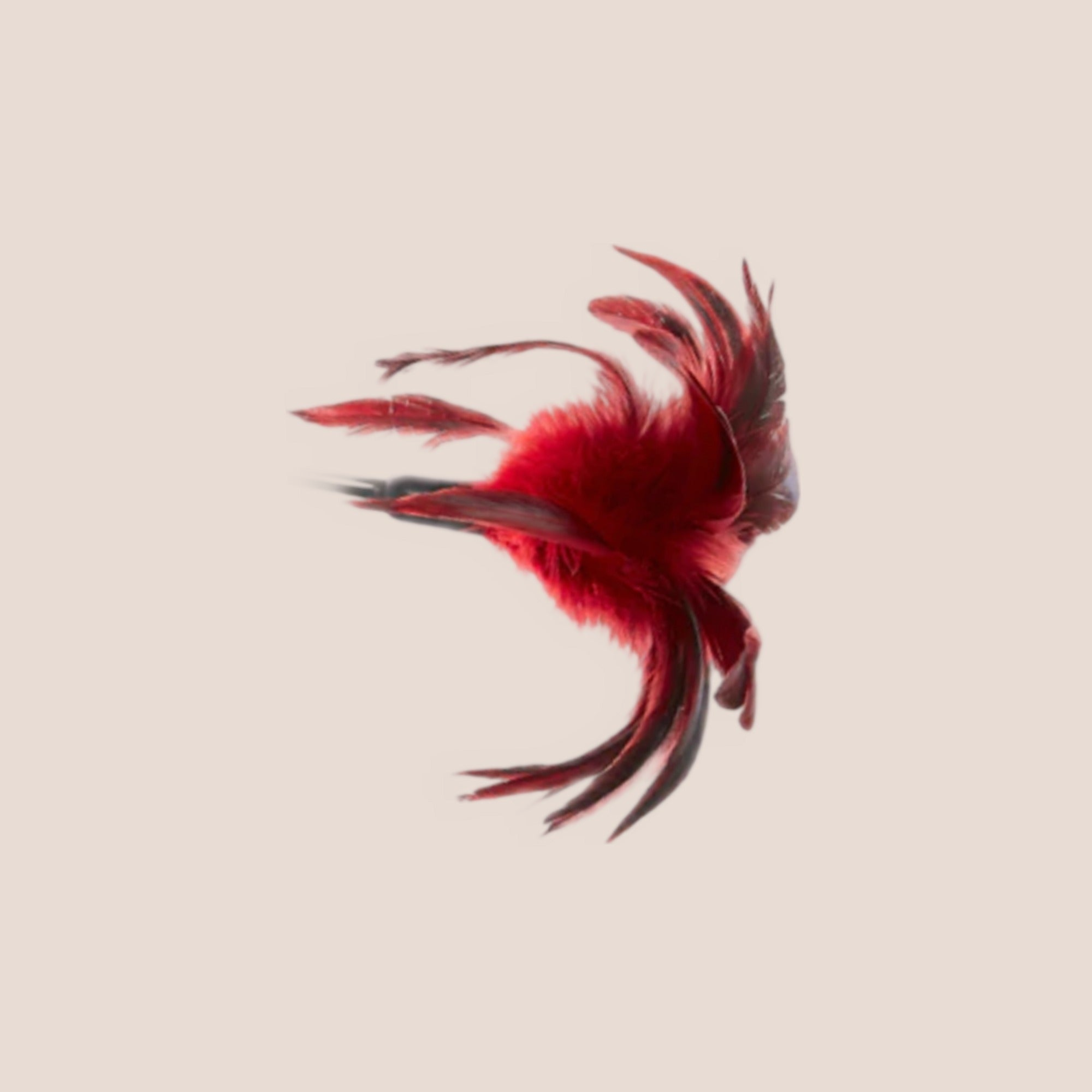 Plunged — restraint piece on a warm blush background