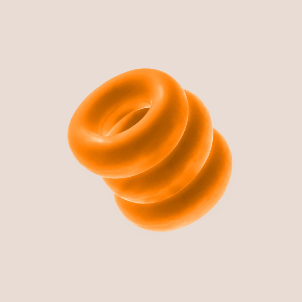 Pronounced — intimate ring on a warm blush background