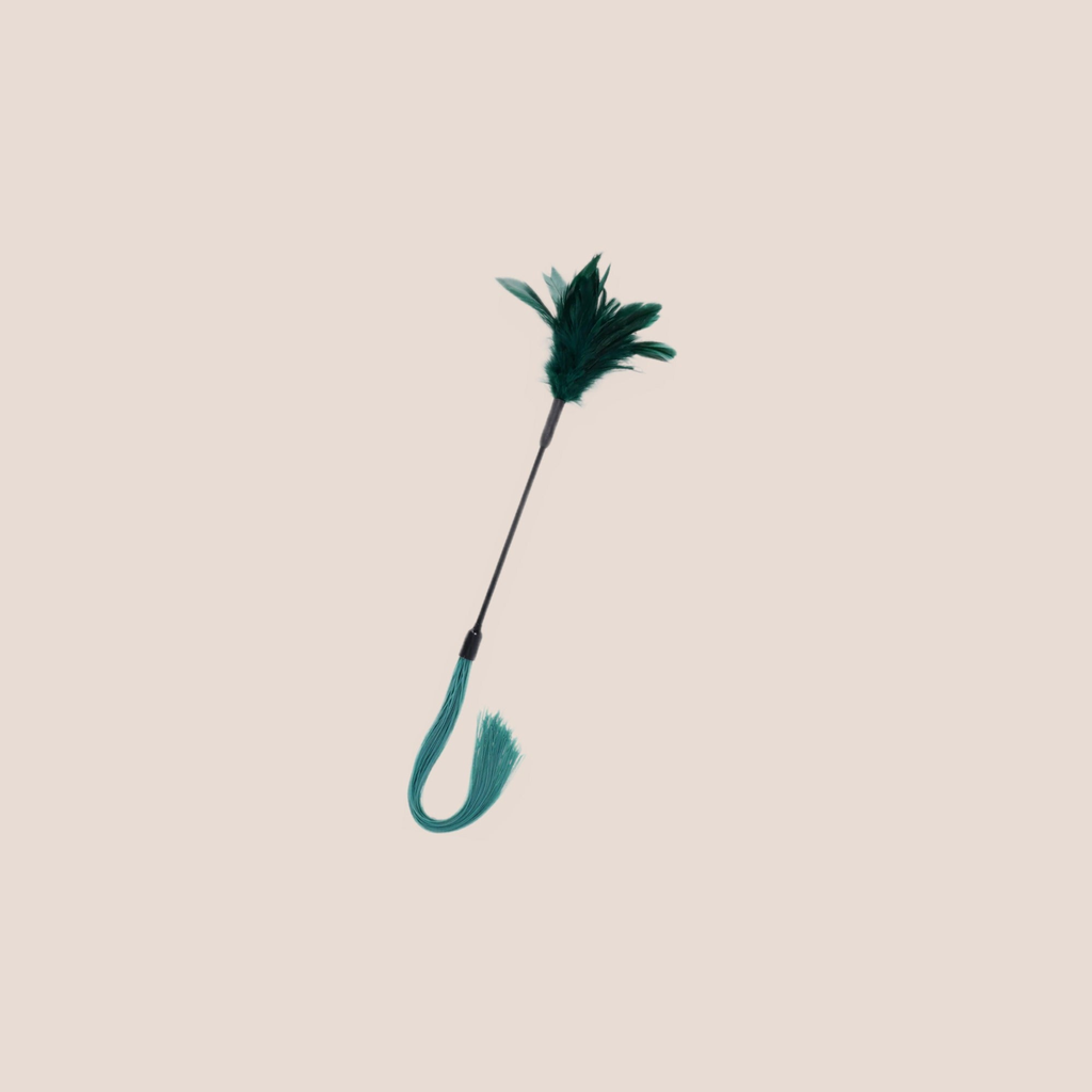 Quickened — restraint piece on a warm blush background