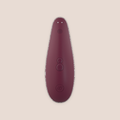 Reflective — intimate massager on a warm blush background
