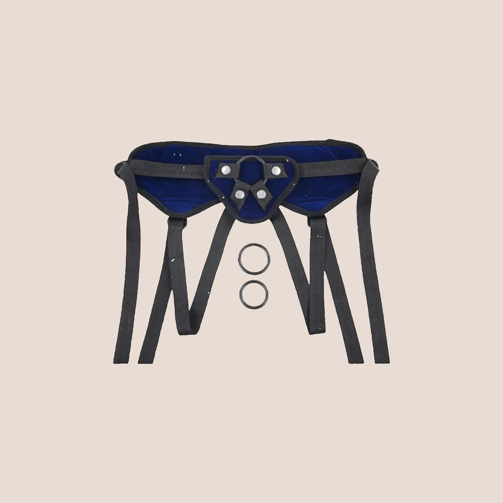 Released — harness piece on a warm blush background
