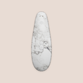 Remarkable — intimate massager on a warm blush background