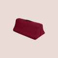 Rounded — restraint piece on a warm blush background