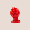 Secure — weighted intimate plug on a warm blush background