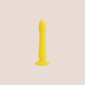 Showered — weighted intimate plug on a warm blush background
