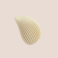Trace — intimate massager on a warm blush background