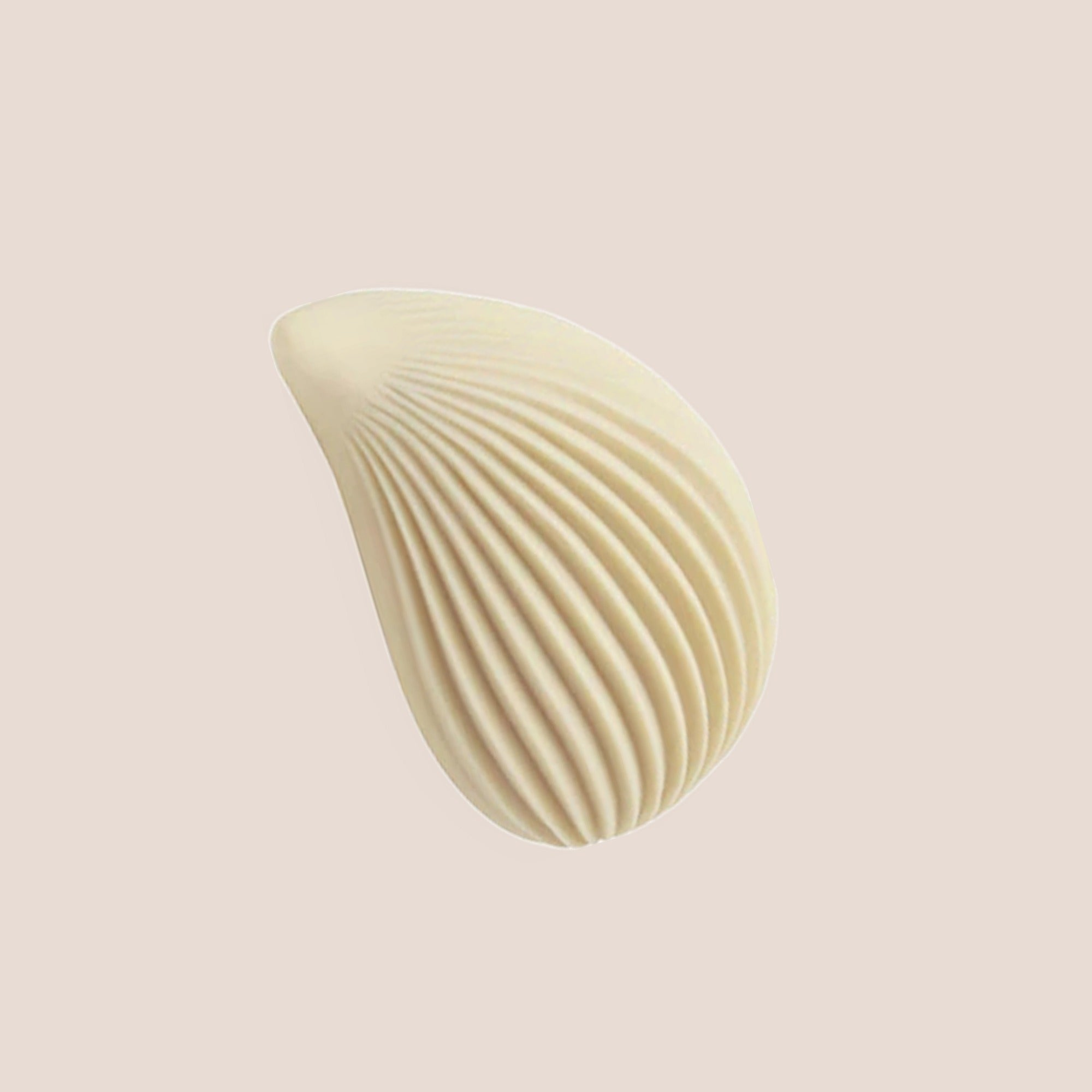 Trace — intimate massager on a warm blush background