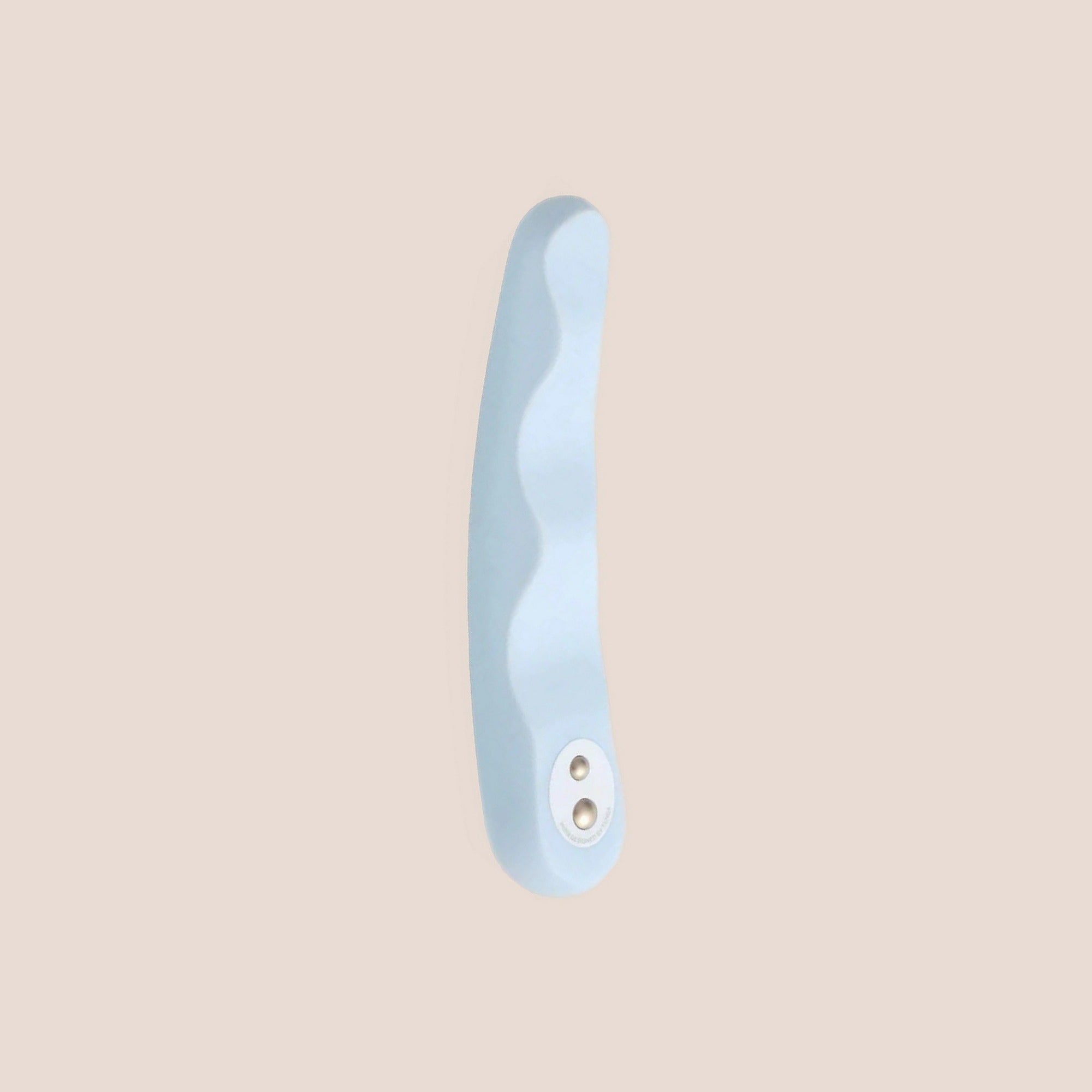 Tranquil — intimate massager on a warm blush background