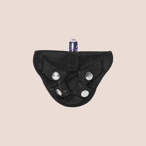 Assured — harness piece on a warm blush background
