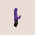 Unfurling — intimate massager on a warm blush background