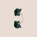 Unveiled — restraint piece on a warm blush background