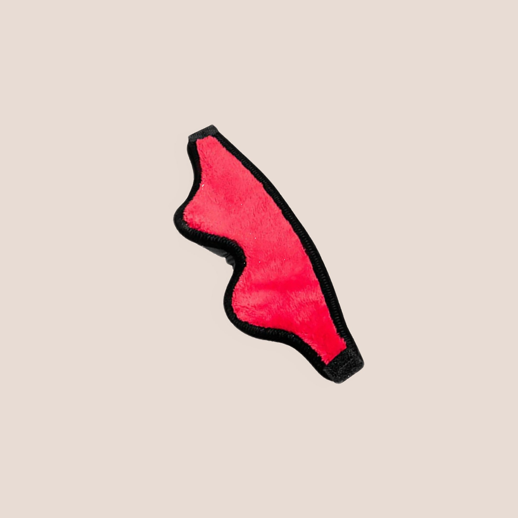 Veiled — restraint piece on a warm blush background