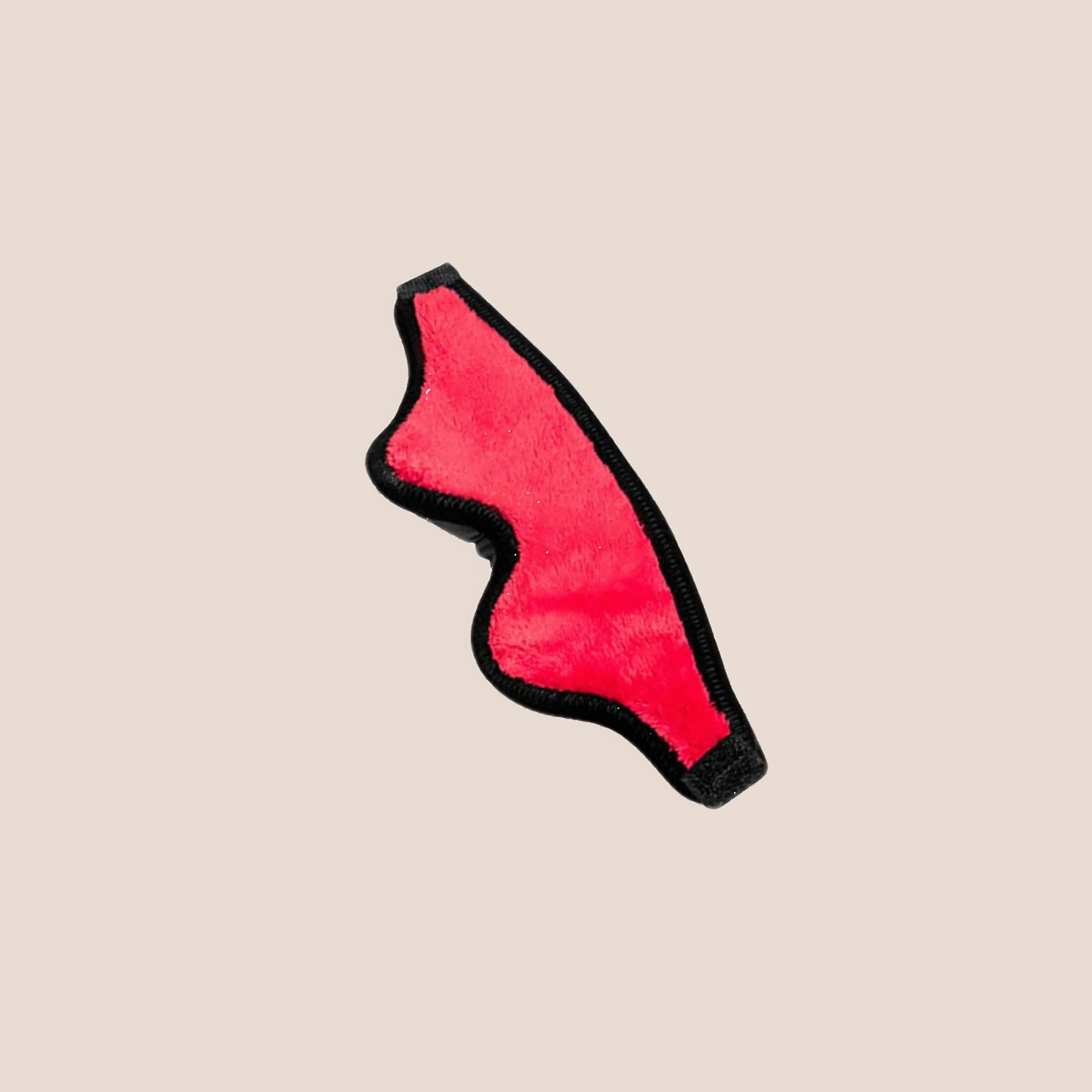 Veiled — restraint piece on a warm blush background